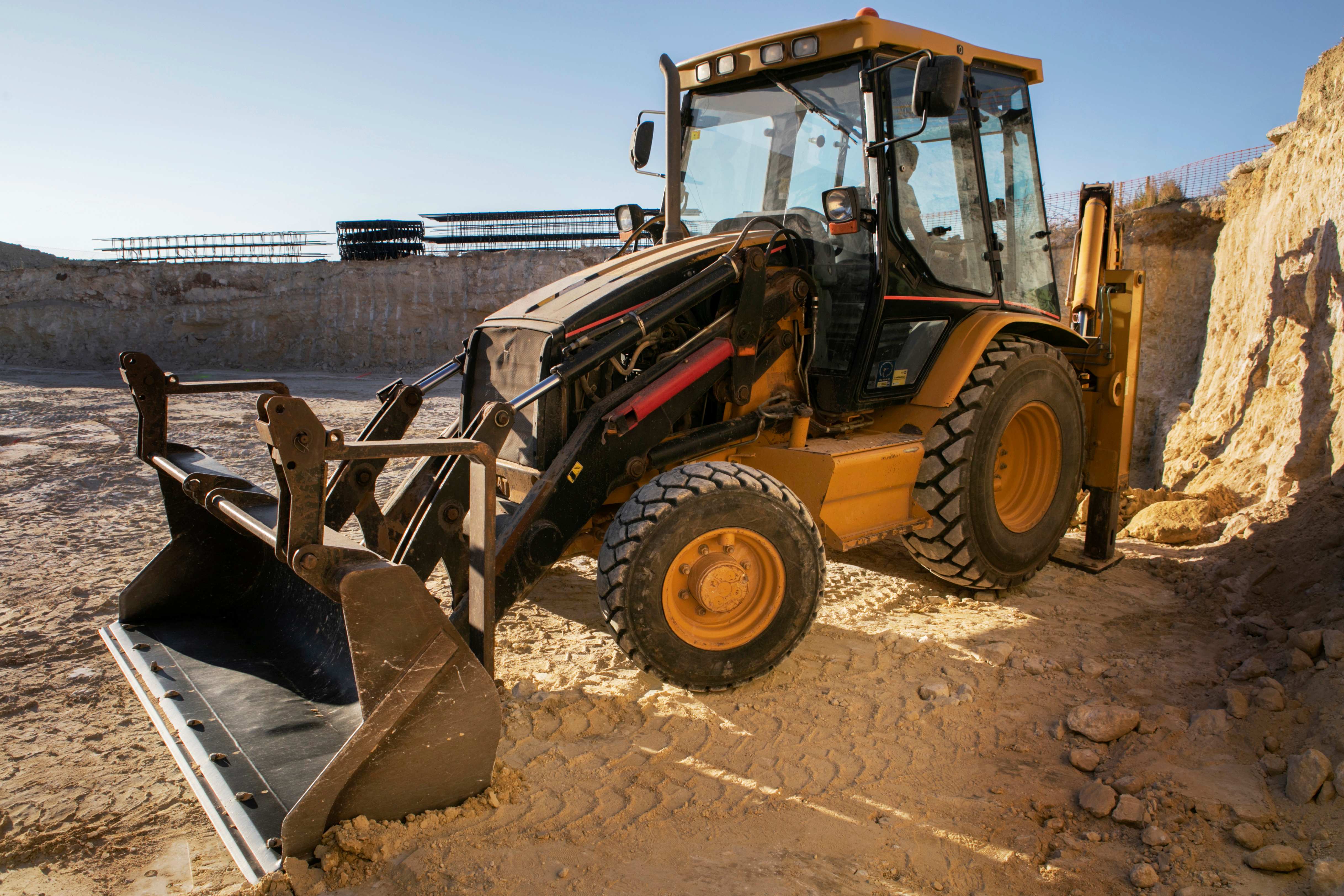 Yellow wheel loader construction equipment on site
